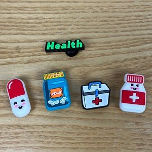 5 different health related croc charms